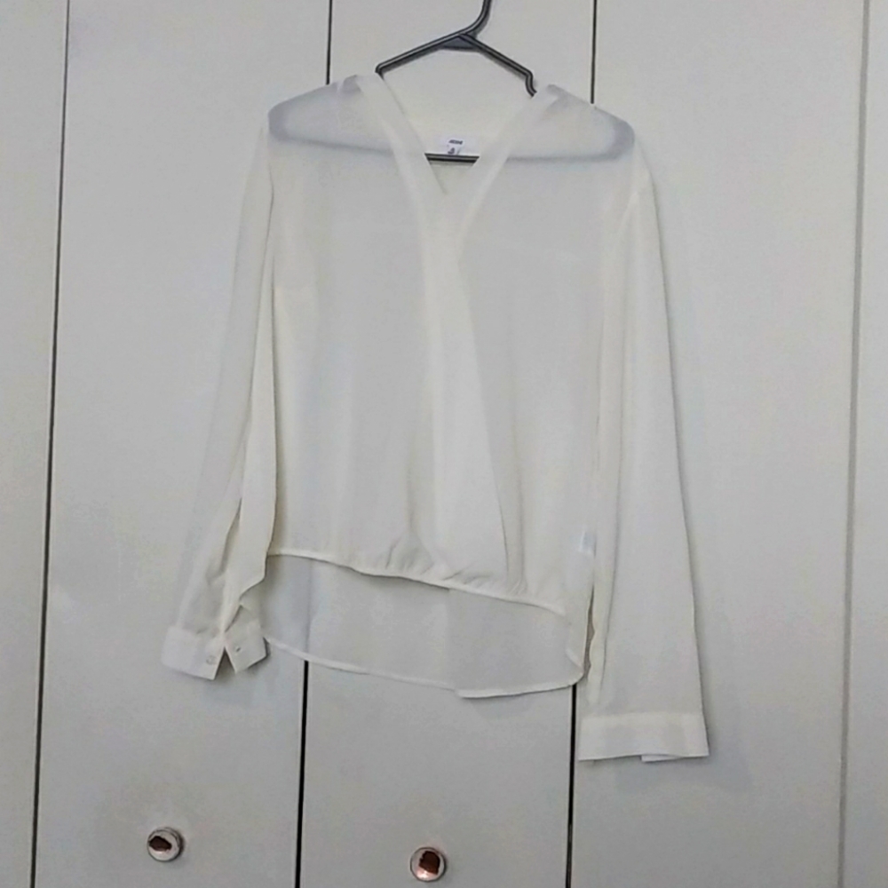 White see-through blouse with on with noticeable stains on it as indicated
